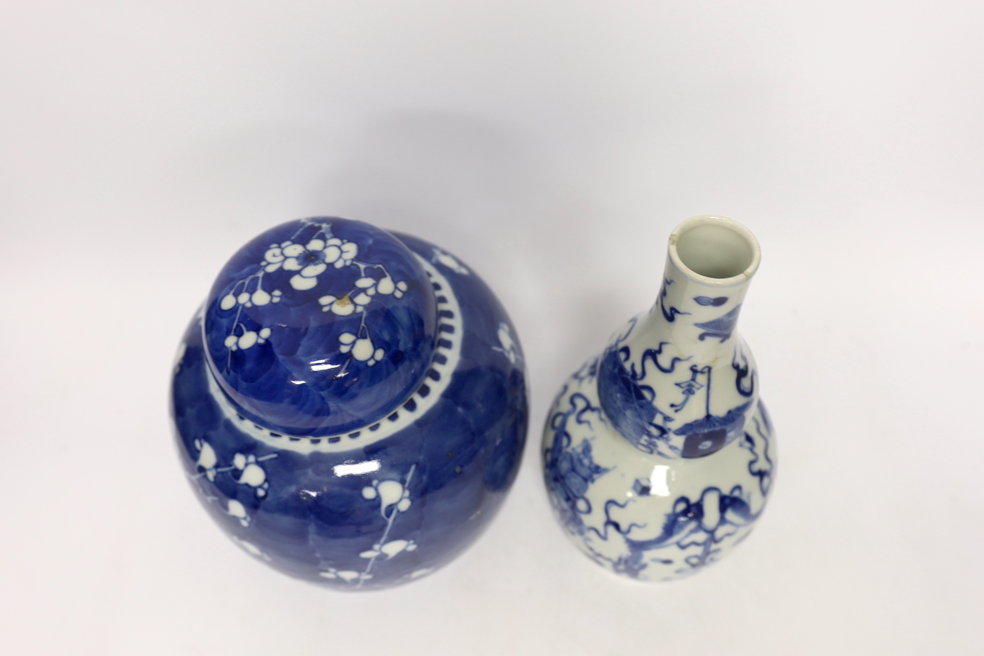 A Chinese blue and white prunus jar and cover and a double gourd vase, late 19th/early20th century, tallest 23cm